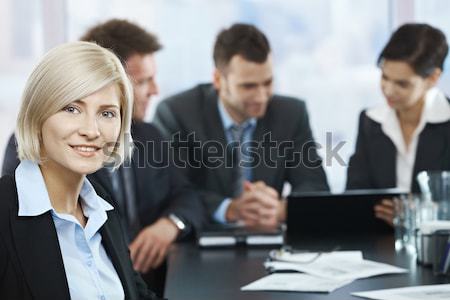 Mosolyog üzletasszony portré megbeszélés kamera kollégák Stock fotó © nyul