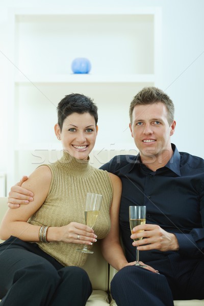 Pár pezsgő szeretet szemüveg otthon kanapé Stock fotó © nyul