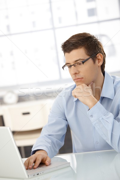 Young businessman concentrating on computer work Stock photo © nyul