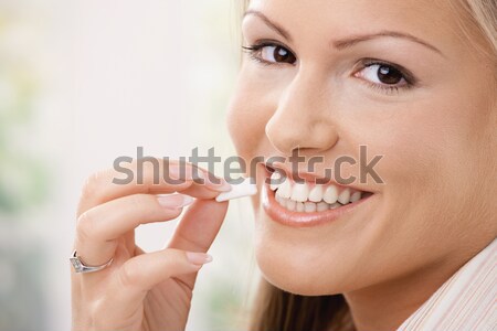 Girl taking chewing gum Stock photo © nyul
