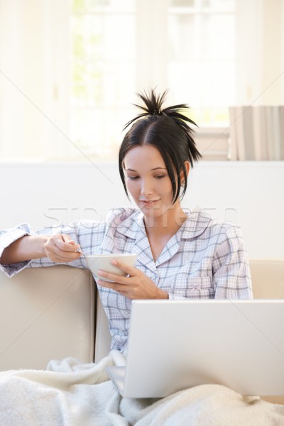 Jonge vrouw ontbijt laptop vergadering woonkamer granen Stockfoto © nyul