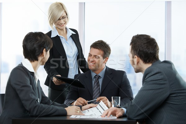 Happy businesspeople at meeting Stock photo © nyul