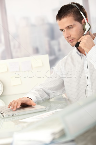 Young male dispatcher working in office Stock photo © nyul