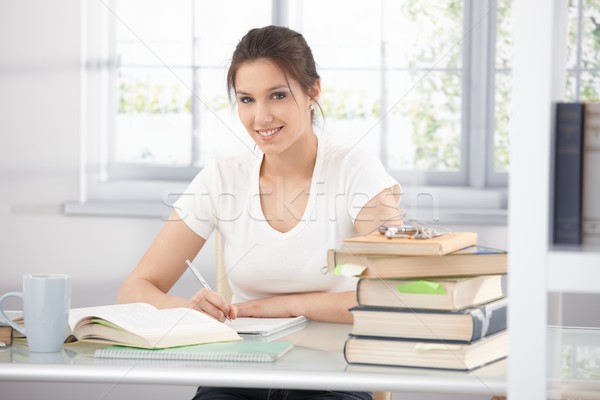 College student learning at home smiling Stock photo © nyul