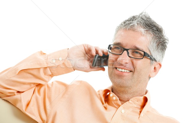 Férfi beszél mobiltelefon lezser visel farmer Stock fotó © nyul