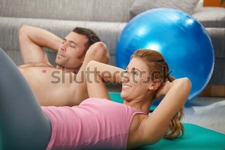 Goodlooking guy doing push up in gym Stock photo © nyul