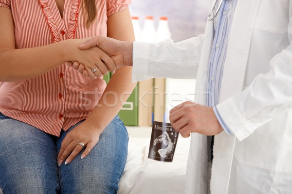 Shaking hands at pregnant consultancy Stock photo © nyul