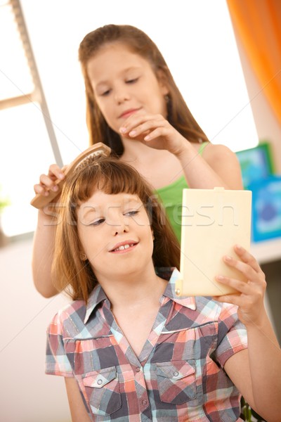 Small girl getting hair comb Stock photo © nyul