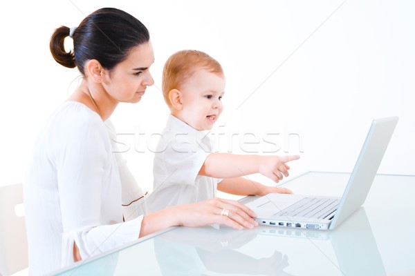 Mother and baby using laptop Stock photo © nyul