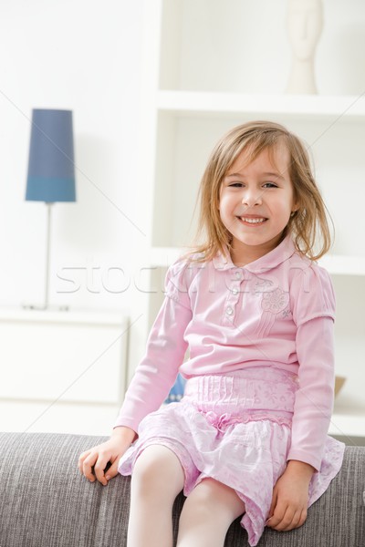 Ritratto felice bambina rosa abito seduta Foto d'archivio © nyul