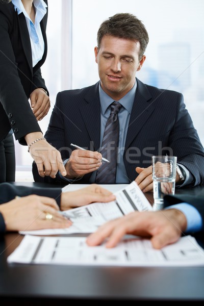 Smiling executive signing contract Stock photo © nyul