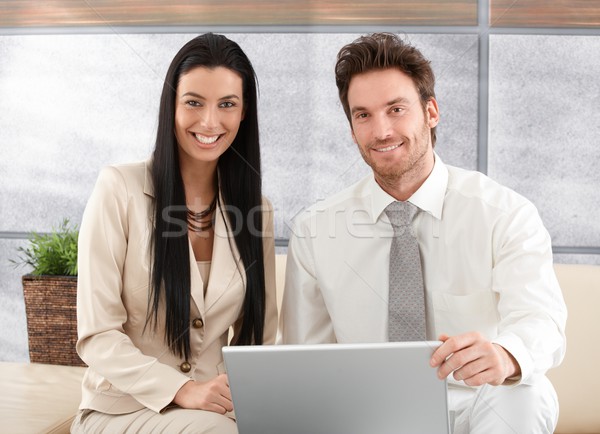 Elegant couple browsing internet at home smiling Stock photo © nyul