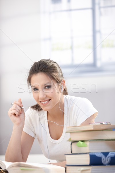 Pretty college student learning at home smiling Stock photo © nyul