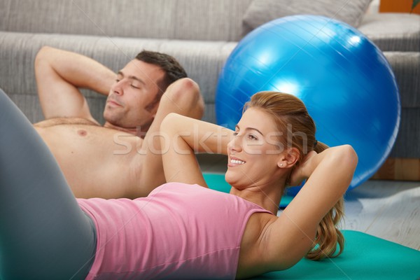 Couple doing abdominal crunch Stock photo © nyul