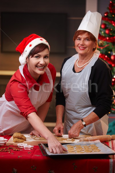 Portrait of mum and daughter at christmas baking Stock photo © nyul
