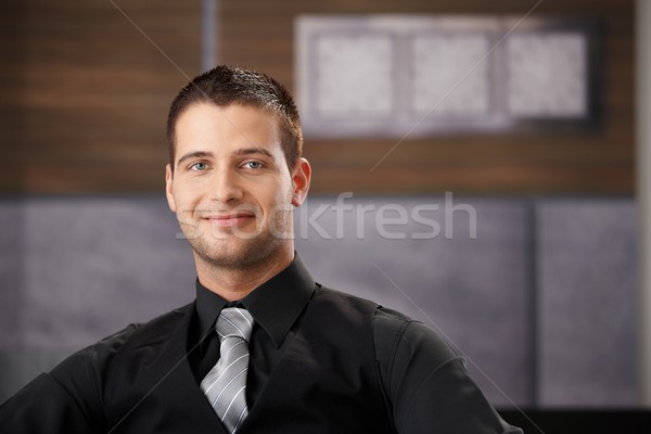 Portrait of goodlooking businessman smiling Stock photo © nyul