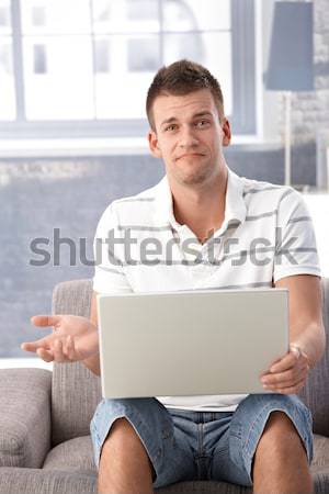 Goodlooking man with laptop Stock photo © nyul
