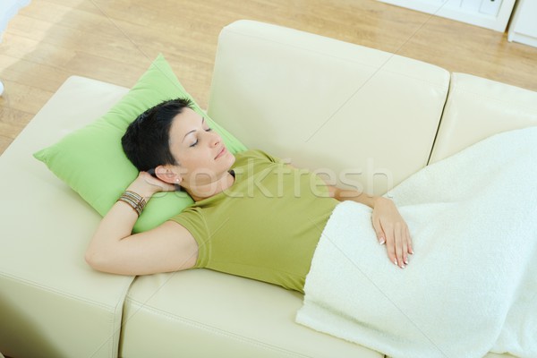 Stock photo: Woman sleeping on couch