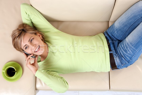 Laughing woman talking on cell Stock photo © nyul