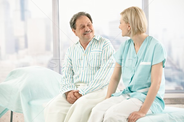 Older patient talking to nurse Stock photo © nyul