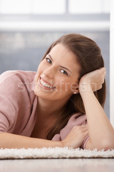 Happy woman smiling on floor Stock photo © nyul