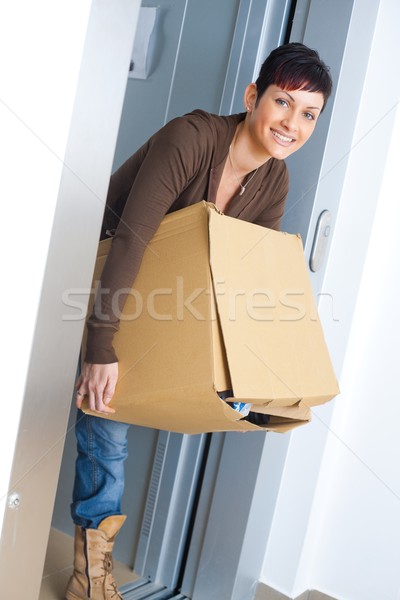 Woman carrying cardboard box Stock photo © nyul