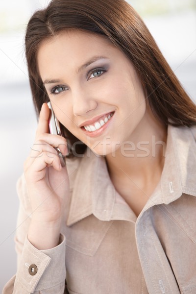 Beautiful woman chatting on mobile smiling Stock photo © nyul
