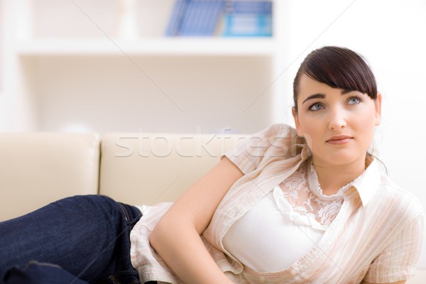 Ev genç kadın bej kanepe kadın Stok fotoğraf © nyul