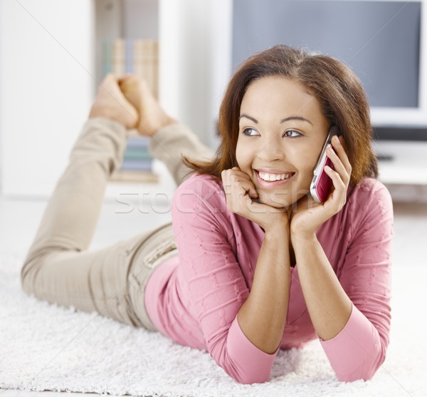 Happy afro girl with mobile phone Stock photo © nyul