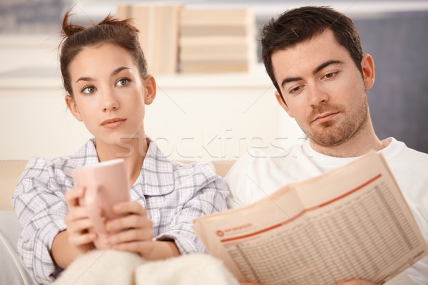 Young couple in bed man reading woman bored Stock photo © nyul