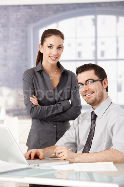 Young colleagues working smiling in bright office Stock photo © nyul