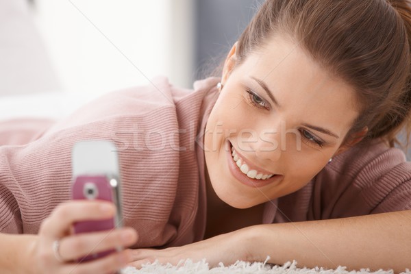Happy woman texting Stock photo © nyul