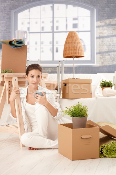 Stock photo: Portrait of young female sitting in new house