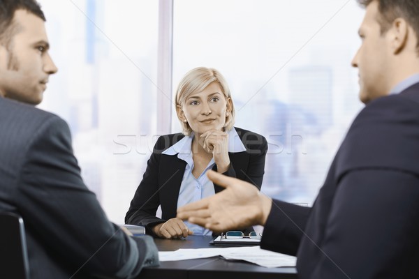 Businesswoman concentrating at meeting Stock photo © nyul