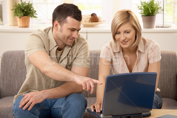 Stock photo: Young couple with computer