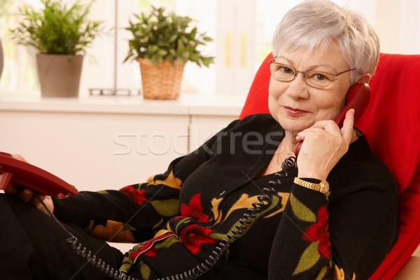 Supérieurs dame téléphone séance salon fauteuil [[stock_photo]] © nyul