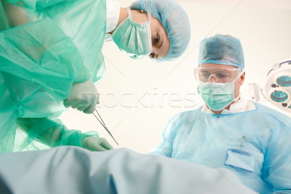 Doctors operating patient Stock photo © nyul