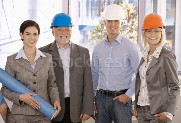 Smiling designer team wearing hardhat Stock photo © nyul