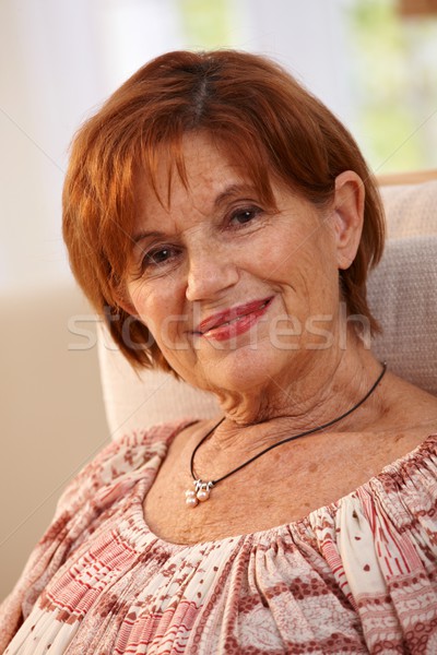 Portrait of attractive elderly woman at home Stock photo © nyul