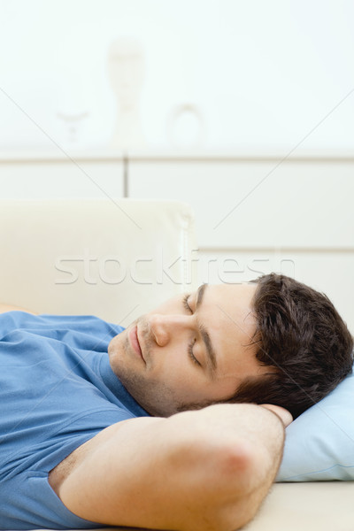 Hombre dormir sofá jóvenes hombre guapo casa Foto stock © nyul