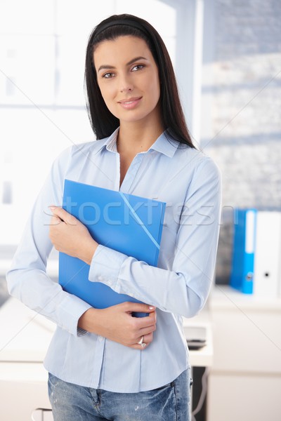 Derűs iroda lány áll mappa mosolyog Stock fotó © nyul