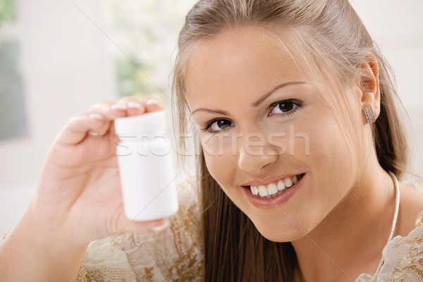 Stockfoto: Vrouw · tonen · pil · fles · mooie · jonge · vrouw