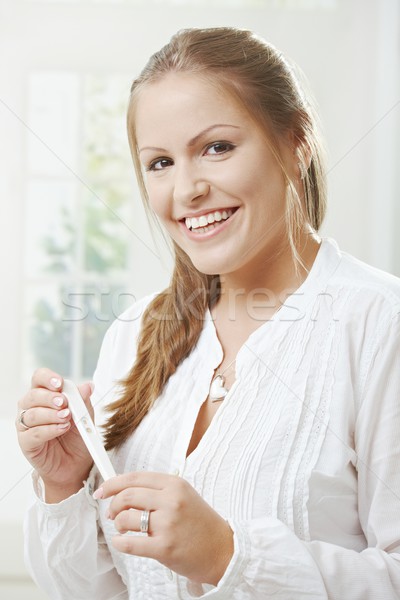 Stock fotó: Nő · tart · terhességi · teszt · portré · boldog · fiatal · nő