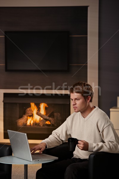 Genç çalışma ev oturma şömine soğuk Stok fotoğraf © nyul