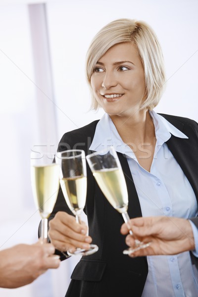 Businesswoman celebrating with champagne Stock photo © nyul