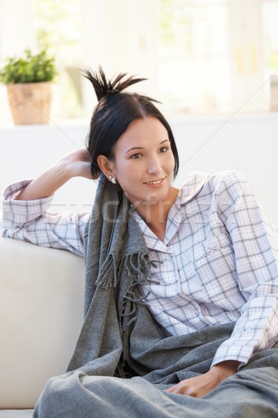 Portrait of young woman in pyjama having blanket Stock photo © nyul