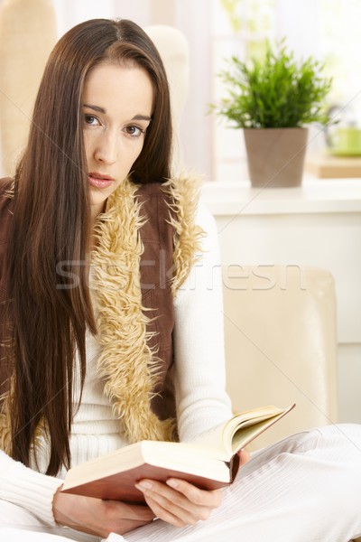 Young woman reading book at home Stock photo © nyul