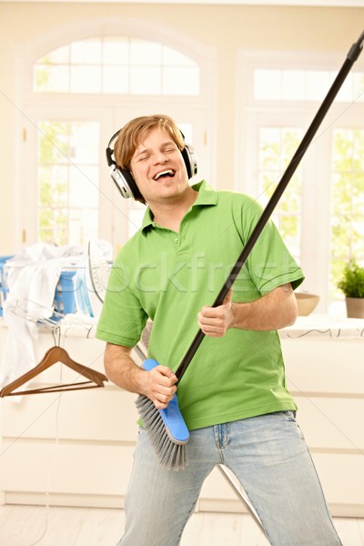 Man singing with broom Stock photo © nyul