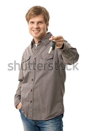 Junger Mann halten Zündung Schlüssel lächelnd Stock foto © nyul