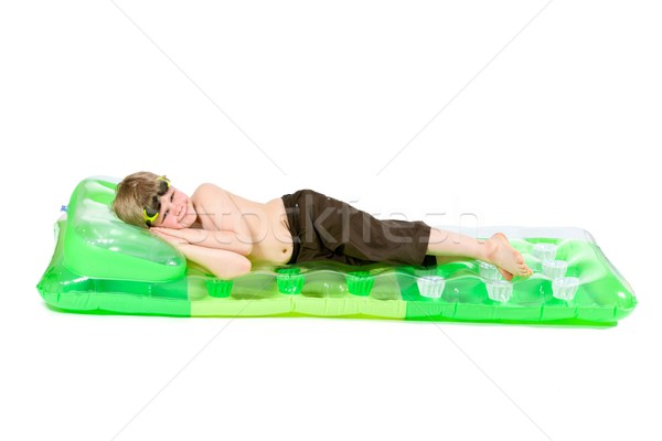 Little boy on beach mattress Stock photo © nyul